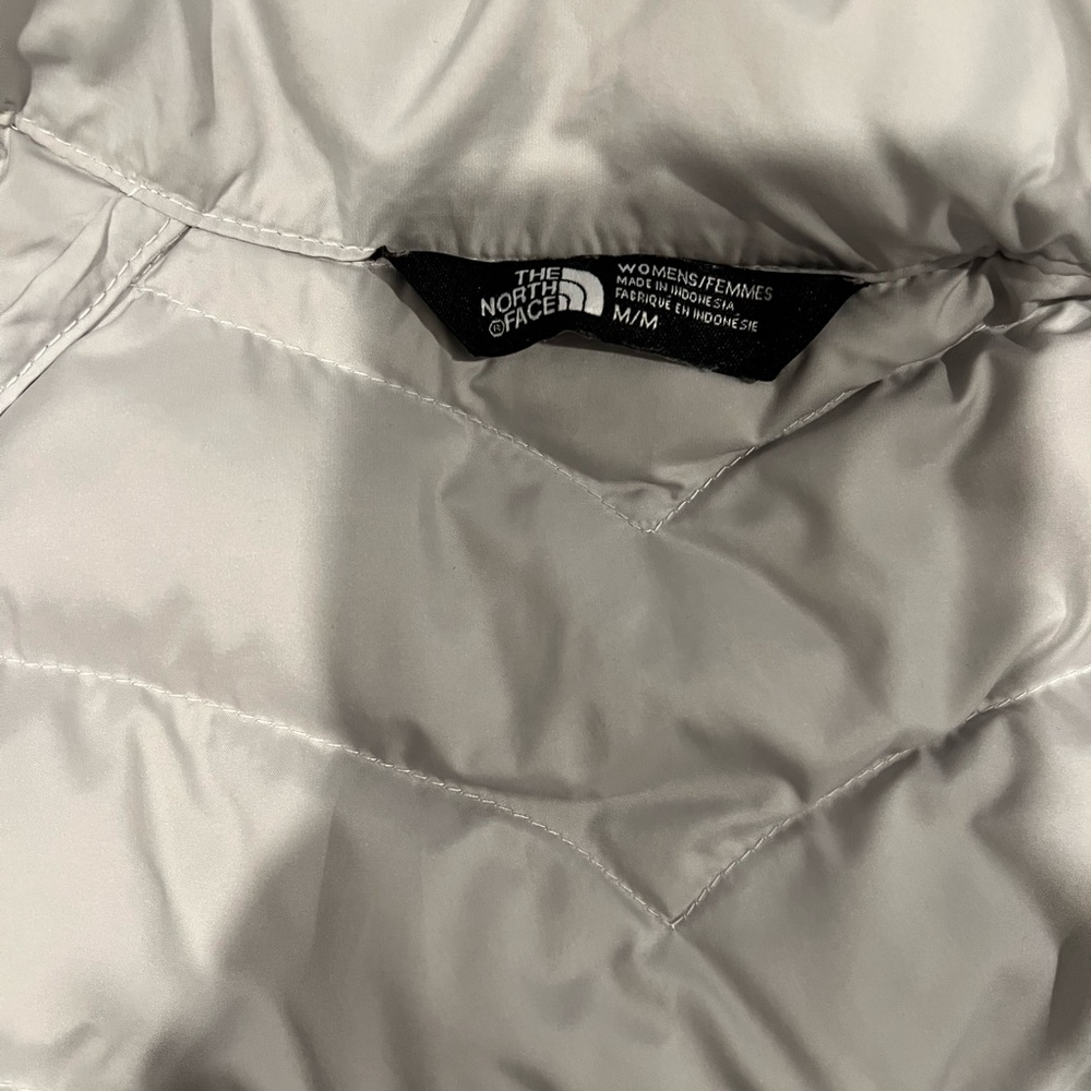 White and grey Northface jacket